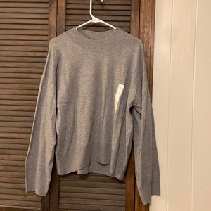 Women’s grey sweater, slightly oversized